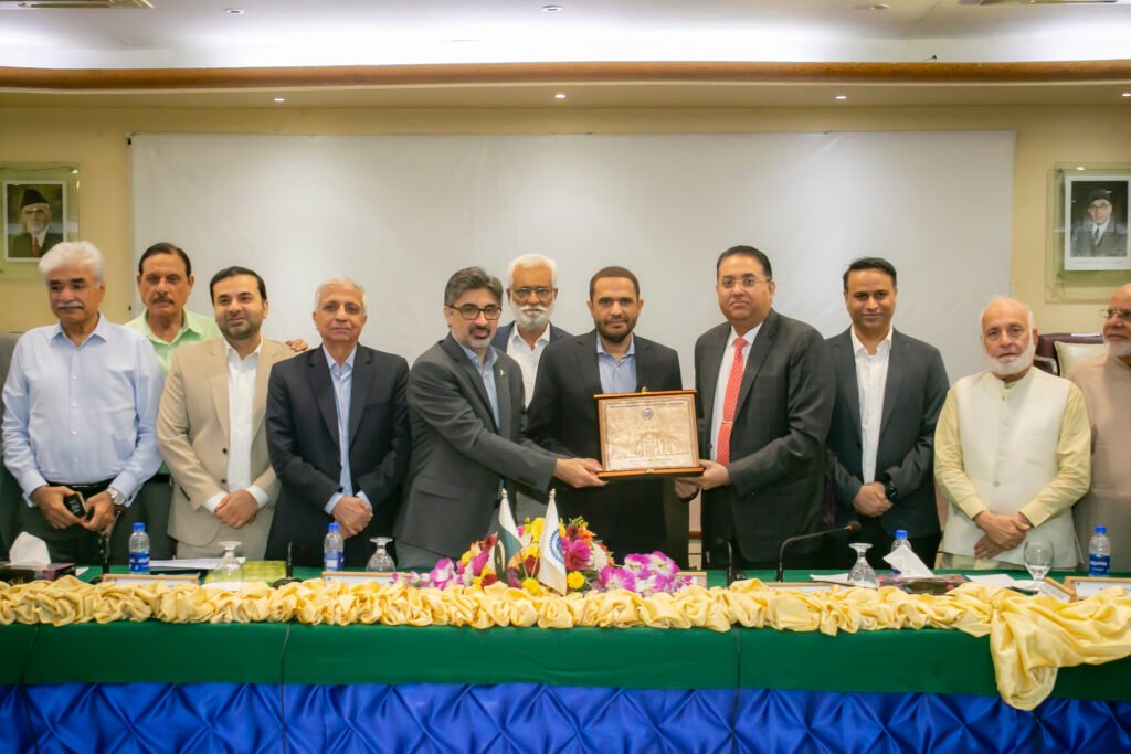 Alt Text: Customs Chief Wajid Ali addressing KCCI business community on cargo clearance